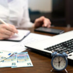Woman working with finances on the table